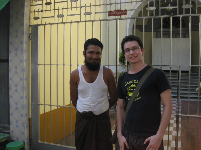 Standing in front of the Musmeah Yeshua Synagogue with its Muslim groundskeeper in Yangon